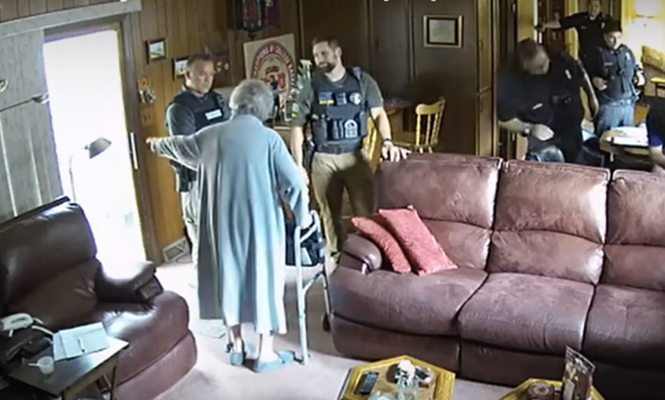 Joan Meyer, 98, is seen in her home during a raid by Marion, Kansas police. Meyer died the next day.