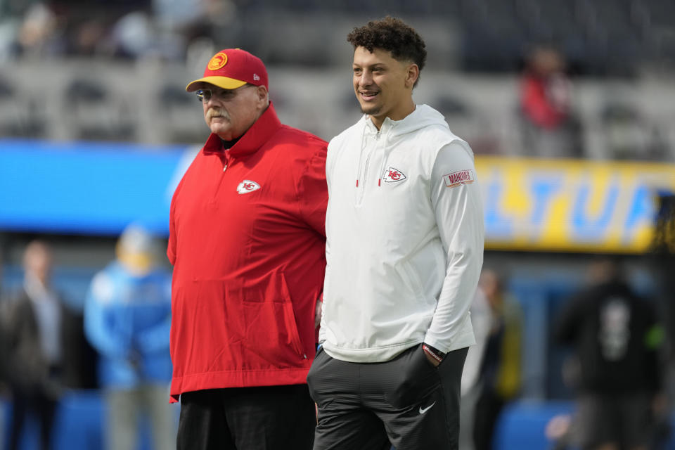 Kansas City Chiefs quarterback Patrick Mahomes, right, looks on alongside head coach Andy Reid before an NFL football game against the Los Angeles Chargers, Sunday, Jan. 7, 2024, in Inglewood, Calif. (AP Photo/Ashley Landis)