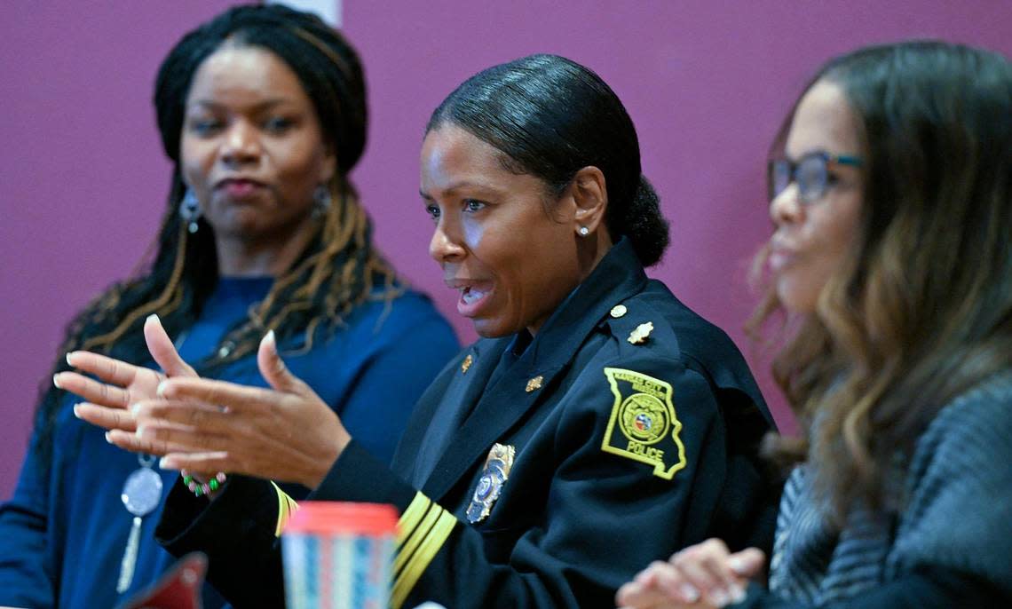 Lisa Benson, left, looks on as Major Kari Thompson of the Kansas City Police Department, center, addresses concerns about missing Black women in Kansas City during “Black and Missing,” a community forum Saturday, Nov. 18, 2022, at the Lucile H. Bluford Branch Library. Thompson said 18 Black women have been killed this year in Kansas City. The event was hosted by Shirley’s Kitchen Cabinet and Hot 103 Jamz whose Julee Jones, right, moderated the discussion.