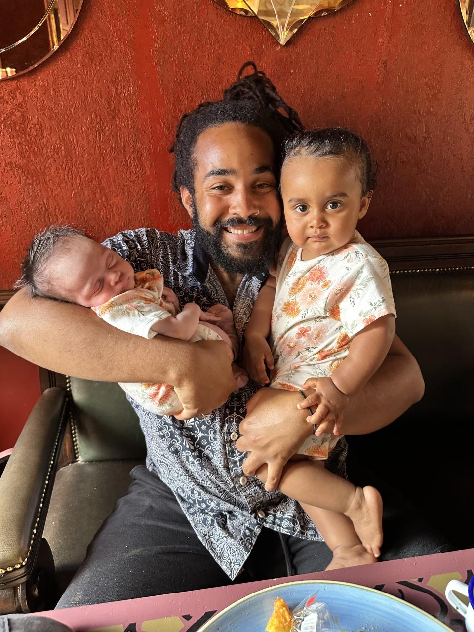 Kieran and Zaya with newborn Kehlani. Kieran was forced to pull over while on their way to hospital after Tiah said she could see the head. (Tiah Parsan/SWNS)
