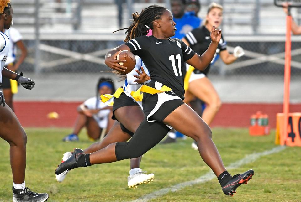 Braden River Pirates' Cydnee Brooks gets a gets a first down against the Gibbs High Gladiators during the Class 1A-District 8 flag football final championship Thursday night April 20, 2023, at Braden River High.