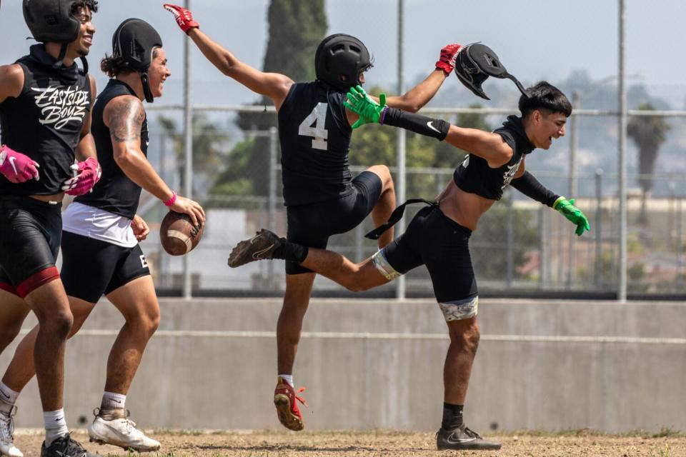 Garfield players have a little fun during a four-team passing competition hosted by their school on Saturday.