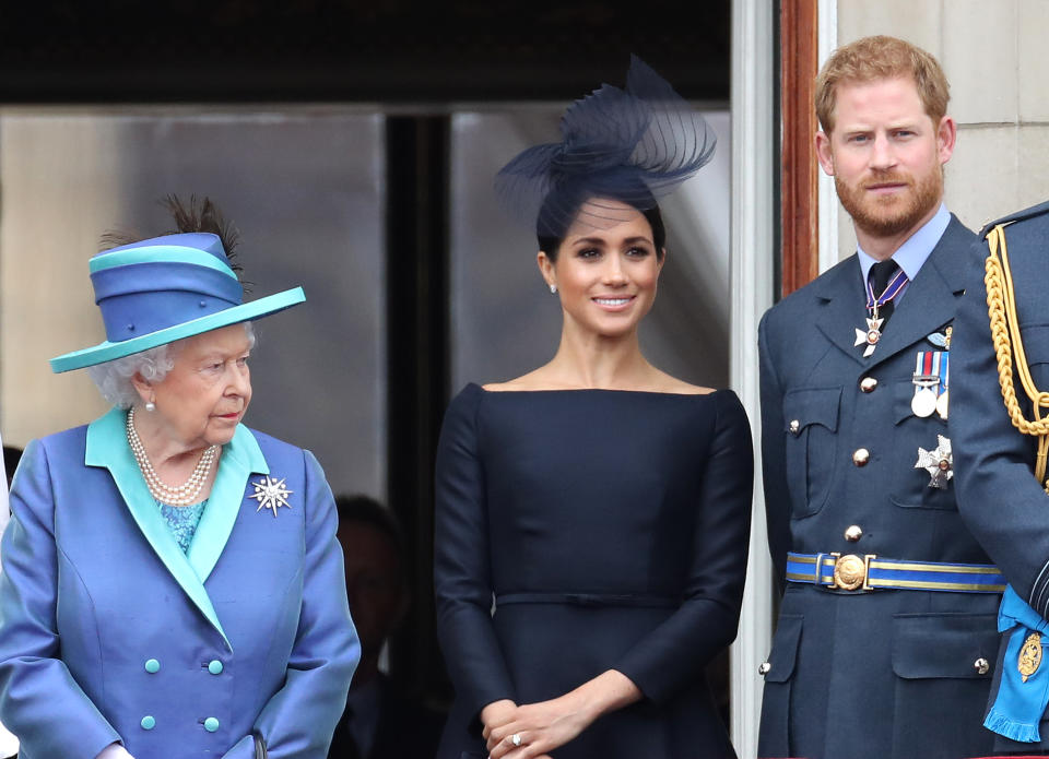 LONDON, ENGLAND - JULY 10: Queen Elizabeth II, Prince Harry, Duke of Sussex and Meghan, Duchess of Sussex on the balcony of Buckingham Palace as the Royal family attend events to mark the Centenary of the RAF on July 10, 2018 in London, England. (Photo by Chris Jackson/Getty Images)