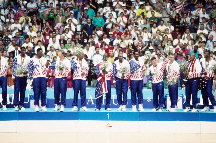 Basketball: 1992 Summer Olympics: USA (left to right) Christian Laettner, David Robinson, Patrick Ewing, Larry Bird, Scottie Pippen, Michael Jordan, Clyde Drexler, Karl Malone, John Stockton, Chris Mullin, and Charles Barkley victorious on podium after winning Men's Gold Medal Game vs Croatia at Pavello Olimpic. Dream Team. Badalona, Spain 8/8/1992 CREDIT: Richard Mackson (Photo by Richard Mackson /Sports Illustrated via Getty Images) (Set Number: X43178 TK47 R1 F22 )