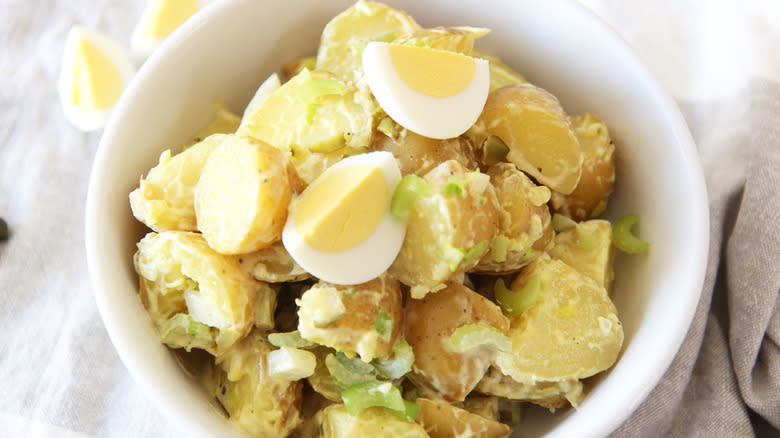 Postatoes and hard-boiled eggs in bowl