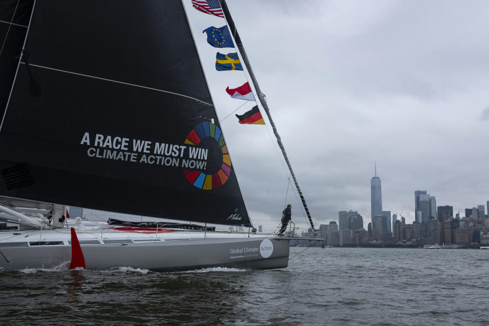 Greta Thunberg, a 16-year-old Swedish climate activist, sails into New York harbor aboard the Malizia II, Wednesday, Aug. 28, 2019. The zero-emissions yacht left Plymouth, England on Aug. 14. She is scheduled to address the United Nations Climate Action Summit on Sept. 23(AP Photo/Craig Ruttle)