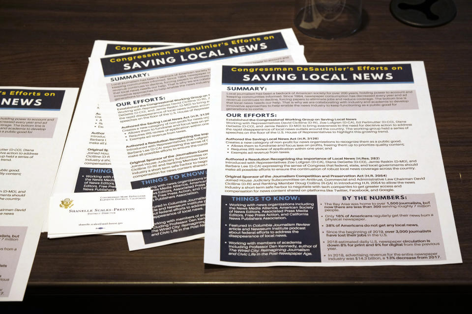 In this July 31, 2019, photo shows flyers that were passed out at a meeting Congressman Mark DeSaulnier held on saving local news in San Francisco. "It is really shocking that the place with the demographics and the business and the universities and the progressiveness, that this is a news desert ... " said DeSaulnier, a Democrat who represents a significant part of the East Bay. (AP Photo/Eric Risberg)