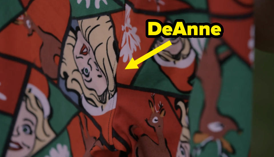 A close up of a holiday legging with reindeer and DeAnne in a santa hat