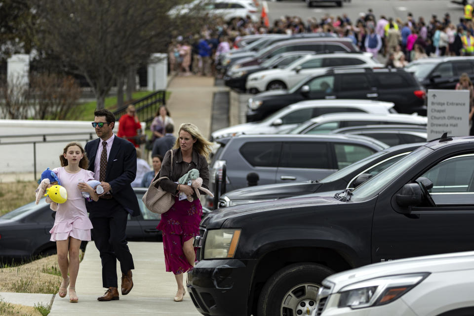 A young girl holds a plush animal as she and her family leave the funeral service held for The Covenant School shooting victim Evelyn Dieckhaus at the Woodmont Christian Church Friday, March 31, 2023, in Nashville, Tenn. The toys were donated by an anonymous donor for all the children in attendance. (AP Photo/Wade Payne)