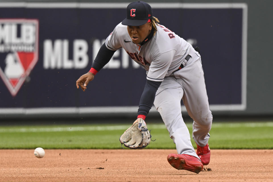 Cleveland Guardians third baseman Jose Ramirez grabs this grounder off the bat of Kansas City Royals' Kansas City Royals Whit Merrifield for an out at first during the first inning of a baseball game, Thursday, April 7, 2022 in Kansas City, Mo. (AP Photo/Reed Hoffmann)