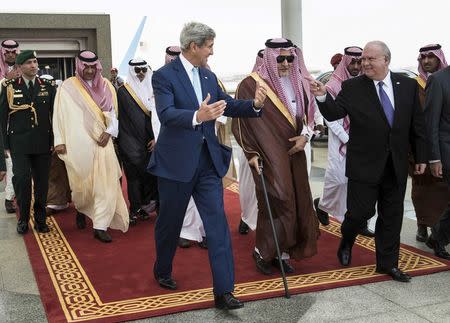 (Front L-R) U.S. Secretary of State John Kerry, Saudi Arabia's Foreign Minister Prince Saud al-Faisal and U.S. Ambassador to Saudi Arabia Joseph W. Westphal walk together upon Kerry's arrival at King Abdulaziz International Airport in Jeddah September 11, 2014. REUTERS/Brendan Smialowski/Pool