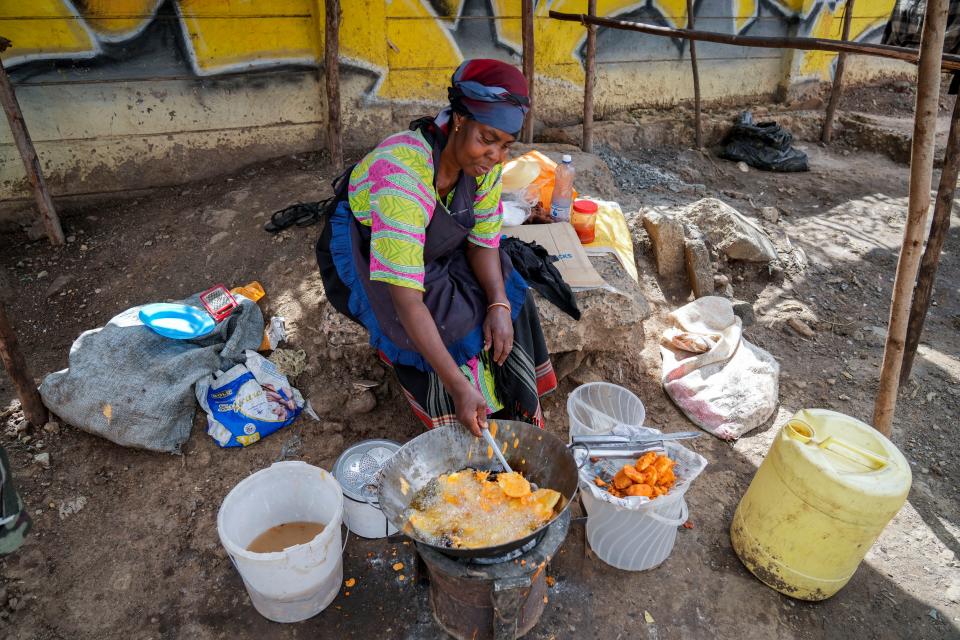 A woman fries potatoes in the low-income Kibera neighborhood of Nairobi, Kenya, Tuesday, April 19, 2022. Russian hostilities in Ukraine are preventing grain from leaving the “breadbasket of the world" and making food more expensive across the globe, raising the specter of shortages, hunger and political instability in developing countries.