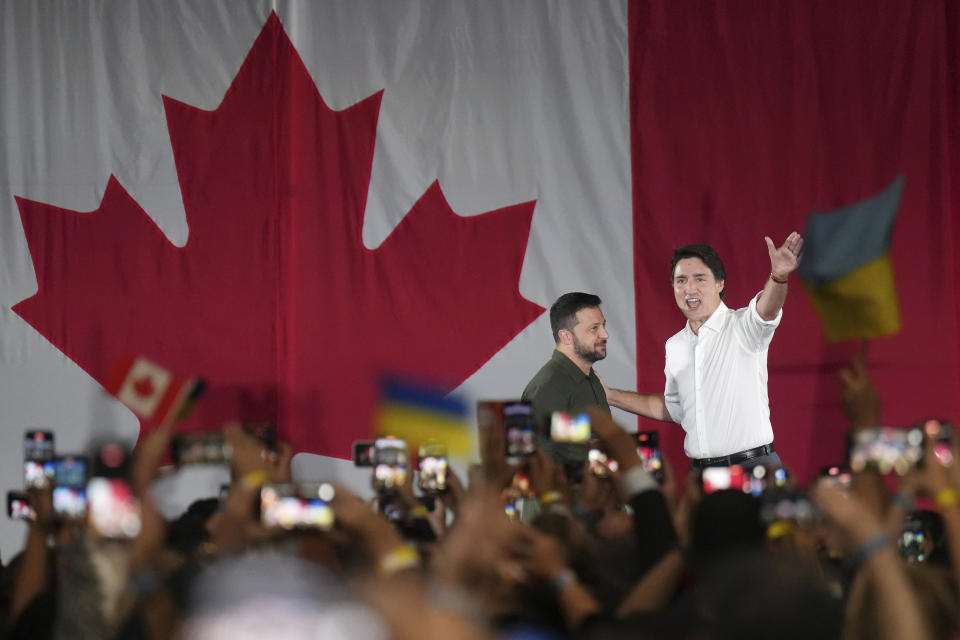 Prime Minister Justin Trudeau, left, introduces Ukrainian President Volodymyr Zelenskyy at a rally at the Fort York Armoury in Toronto on Friday, Sept. 22, 2023. (Nathan Denette/The Canadian Press via AP)