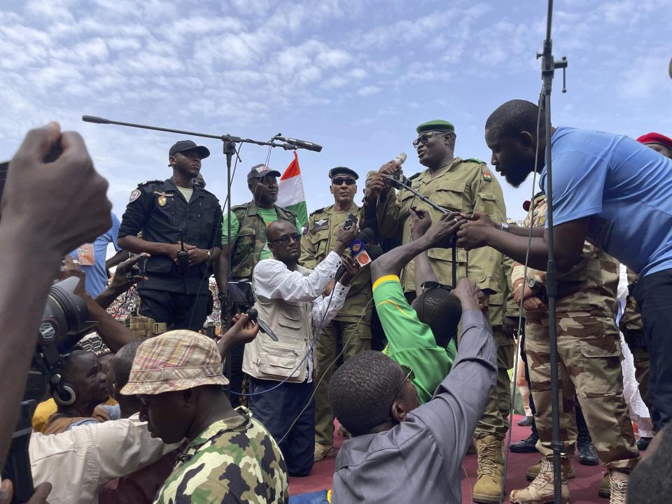 Mohamed Toumba, one of the soldiers who ousted Nigerian President Mohamed Bazoum, addresses supporters of Niger's ruling junta in Niamey, Niger, Sunday, Aug. 6, 2023. Nigeriens are bracing for a possible military intervention as time's run out for its new junta leaders to reinstate the country's ousted president. (AP Photo/Sam Mednick)