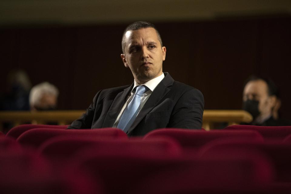 FILE - In this Wednesday, Oct. 21, 2020, file photo, Iias Kasidiaris, former Golden Dawn lawmaker who had been found guilty along with others of leading a criminal organization and face 13 years in prison, looks on during a Golden Dawn trial, in Athens. Greece's government is seeking to ban a far-right political party led by the jailed former lawmaker from participating in a general election later this year, with a legislative initiative that has gained cross party support. Ilias Kasidiaris, 42, founded the Greek National Party two years ago. (AP Photo/Petros Giannakouris, File)