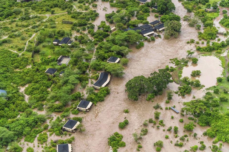 A lodge is seen submerged in this aerial view of the flooded Maasai Mara National Reserve, which left dozens of tourists stranded in Narok County, Kenya, Wednesday, May 1, 2024. Kenya, along with other parts of East Africa, has been overwhelmed by flooding. (AP Photo/Bobby Neptune)
