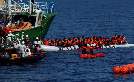 Rescue NGOs Sea-Eye and the Migrant Offshore Aid Station (MOAS) carry out a joint rescue operation as some 20 migrants on a rubber dinghy drowned in the central Mediterranean in international waters off the coast of Libya, April 16, 2017. REUTERS/Darrin Zammit Lupi