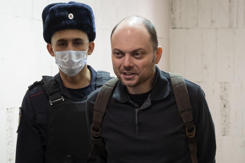 FILE - Russian opposition activist Vladimir Kara-Murza is escorted to a hearing in a court in Moscow, Russia, Feb. 8, 2023. Kara-Murza, another top Russian opposition figure, was sentenced last month to 25 years on treason charges. (AP Photo, File)