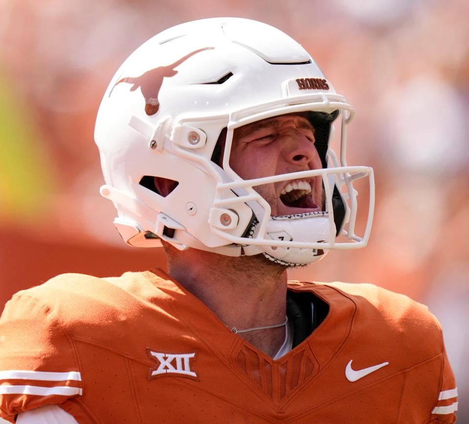 Texas Longhorns quarterback Quinn Ewers celebrates his touchdown in the first quarter against the Kansas Jayhawks at Royal-Memorial Stadium on Saturday September 30, 2023.