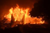 <p>The main building at Paras Vinyards burns in the Mount Veeder area of Napa in Calif., on Oct. 10, 2017. (Photo: Josh Edelson/AFP/Getty Images) </p>