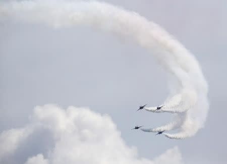 South Korea's Black Eagles aerobatics team perform a maneuver during a preview of the Singapore Airshow at Changi exhibition center in Singapore February 14, 2016. REUTERS/Edgar Su