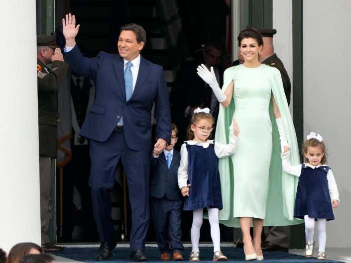 Florida Gov.  Ron DeSantis waves as he stands with his wife Casey and children Mason, Madison, and Mamie, after being sworn in for his second term during an inauguration ceremony at the Old Capitol, Tuesday, January 3, 2023, in Tallahassee, Florida.
