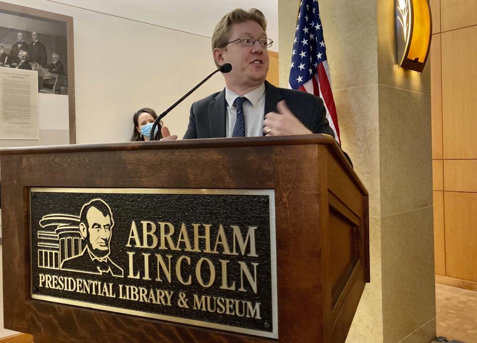 Christian McWhirter, Lincoln historian at the Abraham Lincoln Presidential Library and Museum addresses the importance of the desk that Abraham Lincoln used to draft the presidential inaugural address Thursday, Sept. 16, 2021 in Springfield, Ill.. The desk that Abraham Lincoln used to draft the presidential inaugural address he delivered on March 4, 1861, on the eve of the Civil War, is on display free to the public. Lincoln needed a quiet place away from well-wishers to write the speech, and his brother-in-law, Clark Moulton Smith, offered him a third-floor storage room in the store he owned on the state Capitol square in downtown Springfield. The state purchased the desk from the Smith family in 1953 and this summer spent $6,300 to have it historically restored and repaired. (AP Photo/John O'Connor)