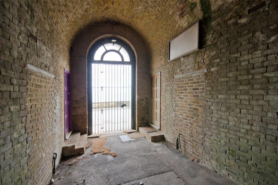 <p>You can tell which of these doors leads to Wonderland Cottage because of its distinctive purple door. (Airbnb) </p>