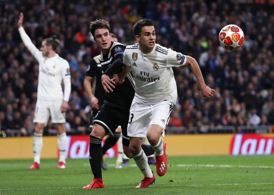 Soccer Football - Champions League - Round of 16 Second Leg - Real Madrid v Ajax Amsterdam - Santiago Bernabeu, Madrid, Spain - March 5, 2019  Real Madrid's Sergio Reguilon in action with Ajax's Nicolas Tagliafico   REUTERS/Sergio Perez