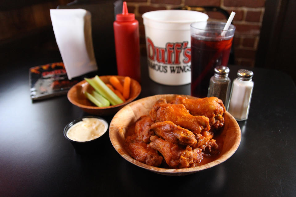 This photo is provided by Visit Buffalo Niagara. Duff’s is known for the fiery heat of their wing sauce, but their BBQ sauce is also full of flavor and not too sweet. (Drew Brown/Visit Buffalo Niagara via AP)