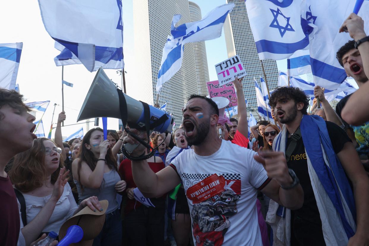 A protester uses a megaphone during a gathering.