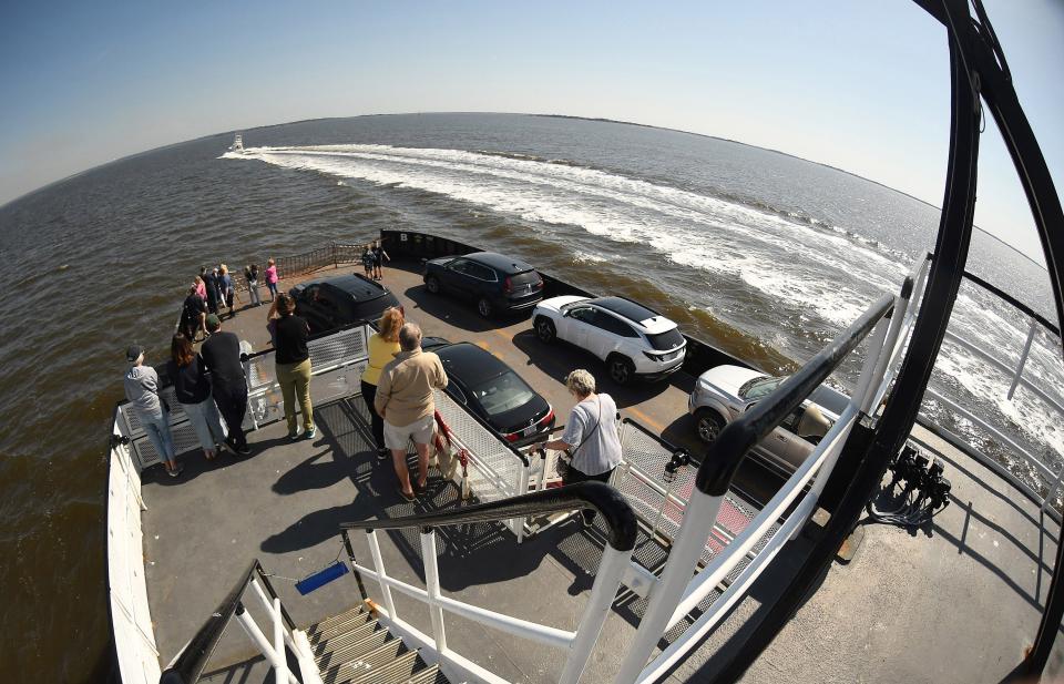 Ferry riders enjoy the views along the Cape Fear River as they cross over to Fort Fisher aboard Fort Fisher-Southport ferry Wednesday March 13, 2024. KEN BLEVINS/STARNEWS