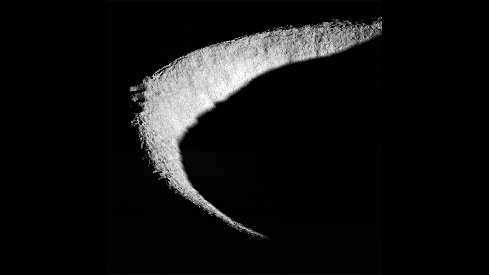 light gray crescent shape on a completely black background