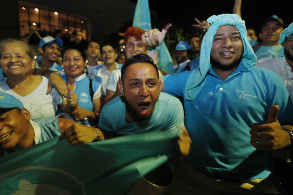 Supporters of the Grand National Alliance for Unity cheer for their presidential candidate Nayib Bukele in San Salvador, El Salvador, Feb. 3, 2019. Bukele, a former mayor of El Salvador's capital, was making a strong run Sunday to end a quarter century of two-party dominance in the crime-plagued Central American nation. (AP Photo/Moises Castillo)
