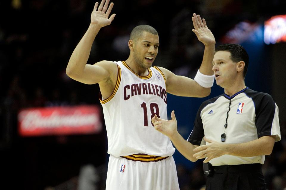 Cavaliers' Anthony Parker protests a call with referee Bob Delaney in a preseason game against the Pistons, Dec. 20, 2011.