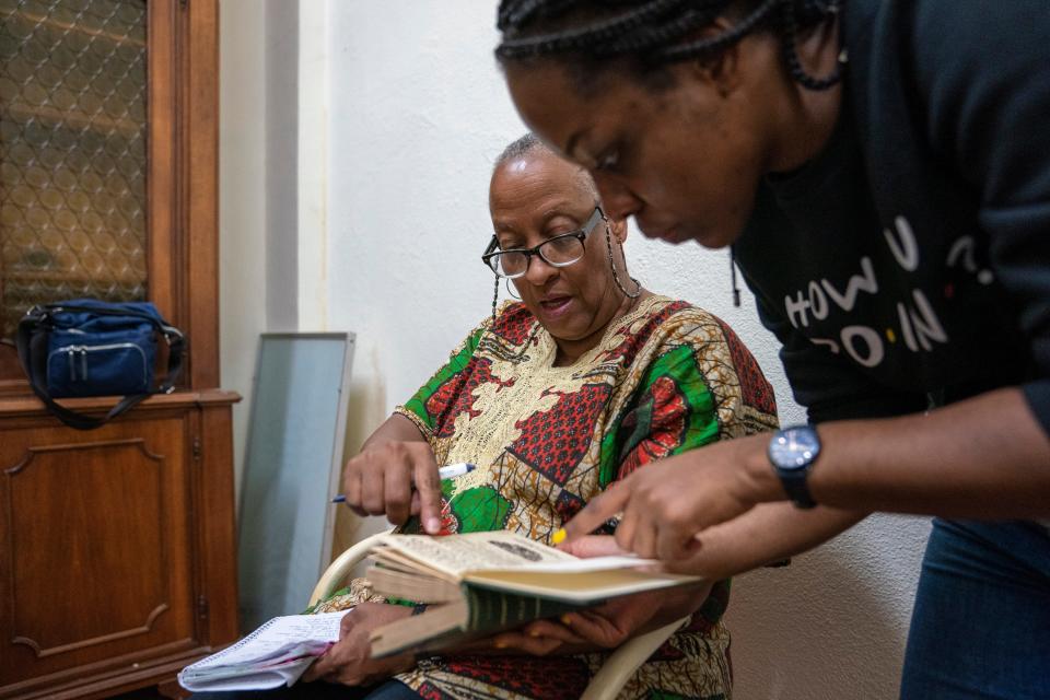 Wanda Tucker listens as Yolanda Manuel translates at the Church of St. Mary of Fatima in Luanda. An ordained minister, former hospital chaplain and professor of religious studies, Wanda was fascinated and disturbed by the complicity of the Catholic Church in the Portuguese slave trade.