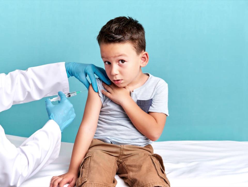 Pediatric doctor is vaccinating the child.