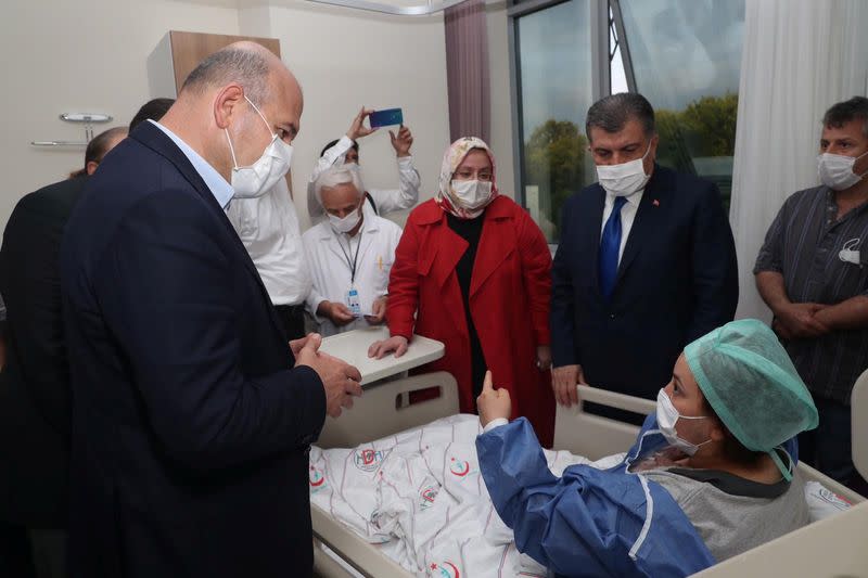 Turkish Ministers visit a person who was wounded following a blast at a firework factory in Hendek