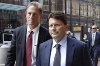 Devin Sloane, right, arrives at federal court for sentencing in a nationwide college admissions bribery scandal, Tuesday, Sept. 24, 2019, in Boston. Sloane admitted to paying $250,000 to get his son into the University of Southern California as a fake athlete. (AP Photo/Elise Amendola)
