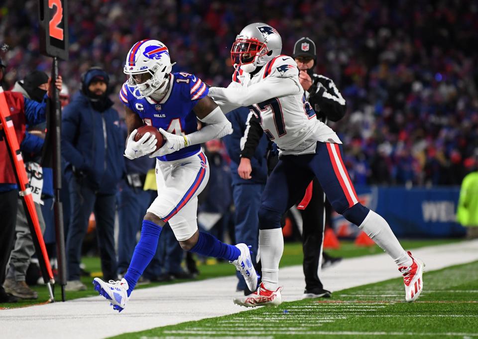 Buffalo Bills wide receiver Stefon Diggs (14) is forced out of bounds by New England Patriots cornerback J.C. Jackson (27) during the first quarter of the AFC Wild Card playoff game at Highmark Stadium.