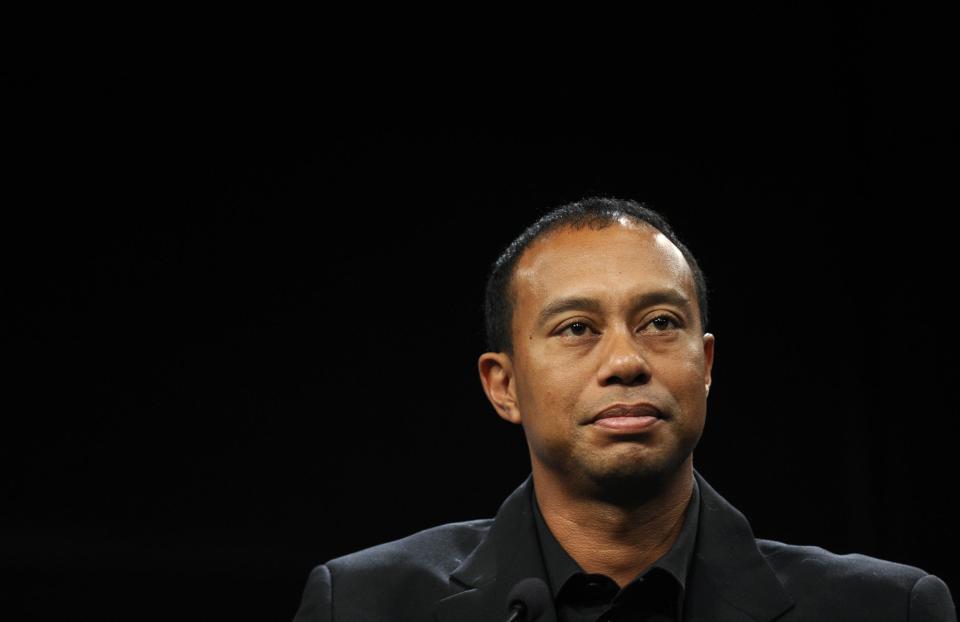 Tiger Woods listens during a news conference at the Newseum in Washington, Monday, March 24, 2014, during an announcement that Quicken Loans had signed a multi-year agreement to become the title sponsor of the Quicken Loans National to be played at Congressional in Bethesda, Md., in June. (AP Photo/Susan Walsh)