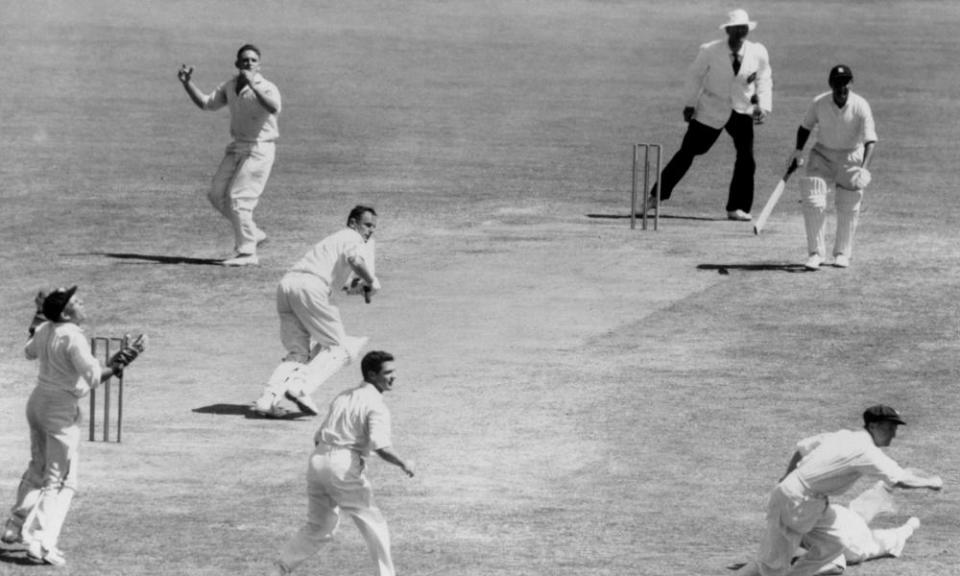 Alan Davidson, second left, after bowling to Peter May in the Third Test against England, Sydney, 1959.