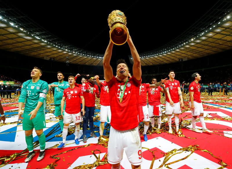 FILE PHOTO: Bayern Munich's Robert Lewandowski and team mates celebrate winning the German Cup following a 3-0 victory over RB Leipzig in the final. Lewandowski scored twice to help Bayern capture their 19th German Cup and complete a domestic double.