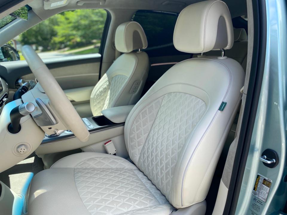 The front seats of a 2024 Genesis GV60 EV.