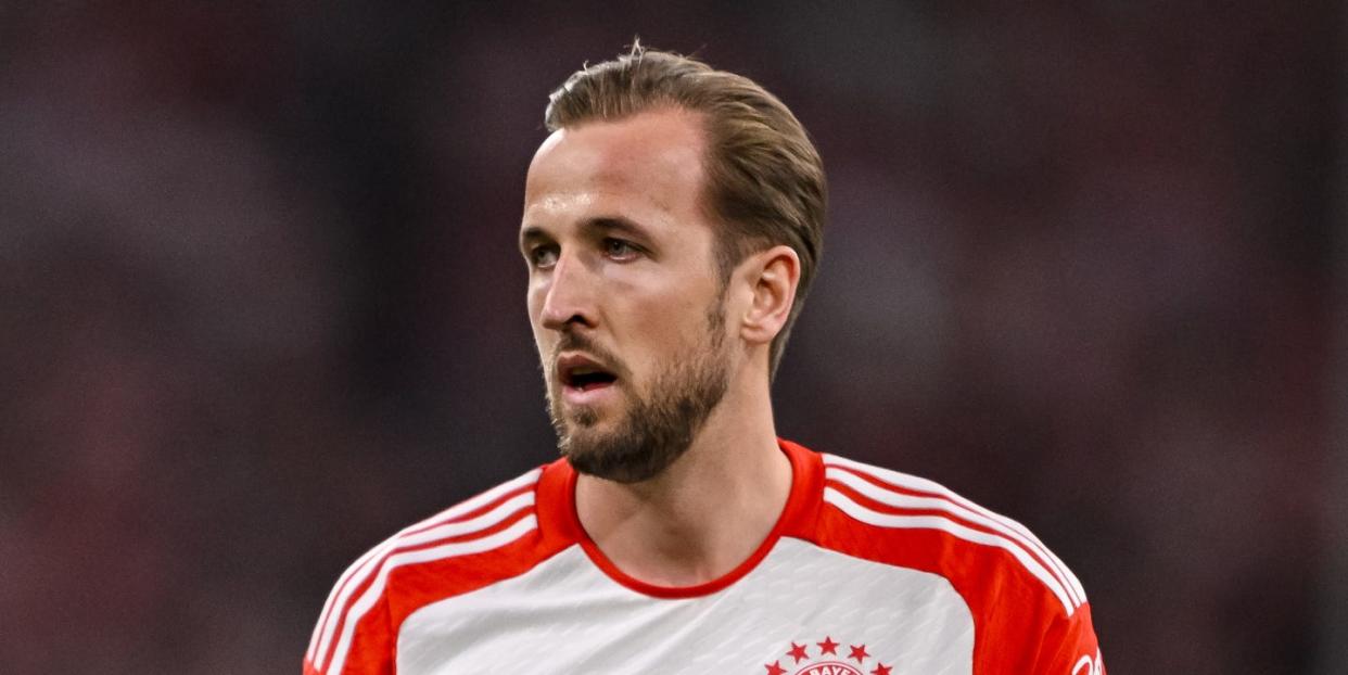 harry kane looks thoughtful as he plays football for bayern munich