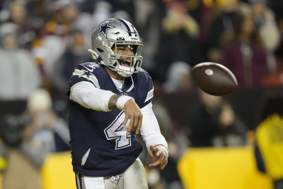 Dallas Cowboys quarterback Dak Prescott (4) throws the ball away while in the end zone during the second half an NFL football game against the Washington Commanders, Sunday, Jan. 8, 2023, in Landover, Md. (AP Photo/Alex Brandon)