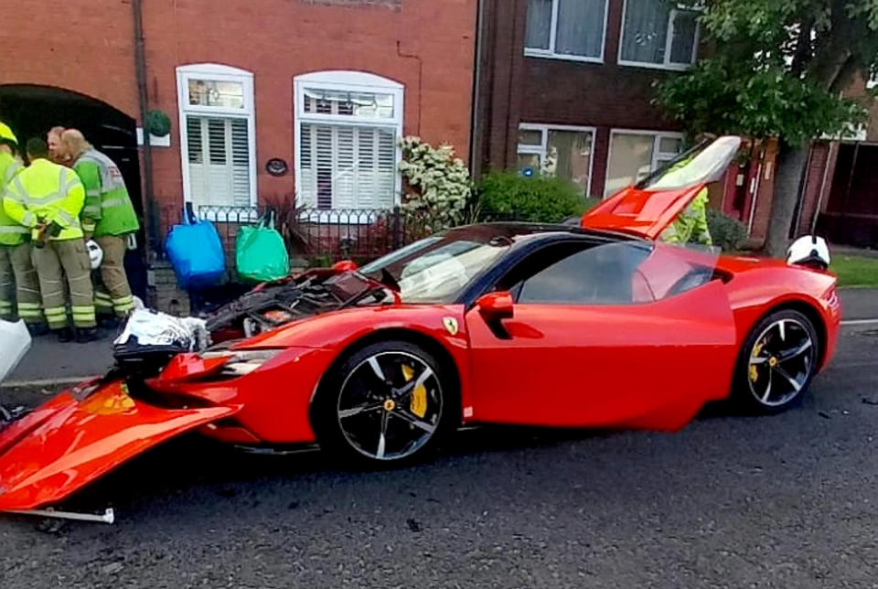 Severe damage caused to a £500,000 Ferrari SF90 involved in a head-on crash in Halesowen, West Midlands.  See SWNS story SWMDferrari. The hypercar, dubbed the 'quickest car of the decade', crashed on Hagley Road last night, Wednesday, May 25.  Firefighters from Haden Cross Fire Station attended the scene and shared photos of the car on social media. The pictures show the extent of the damage including bits of the car strewn over the road. 