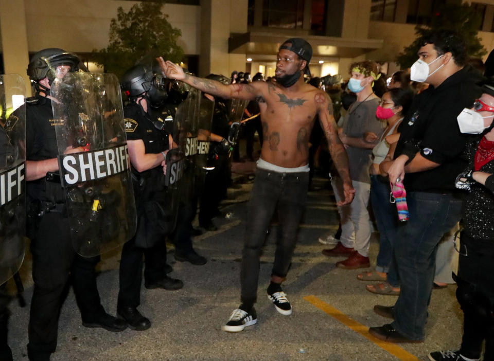 Aug 23, 2020; Kenosha, WI, USA; (Editors note: Vulgar gesture) A man confronts police outside the Kenosha Police Department in Kenosha on Sunday, Aug. 23, 2020. Mandatory Credit: Mike De Sisti/Milwaukee Journal Sentinel via USA TODAY NETWORK/Sipa USA