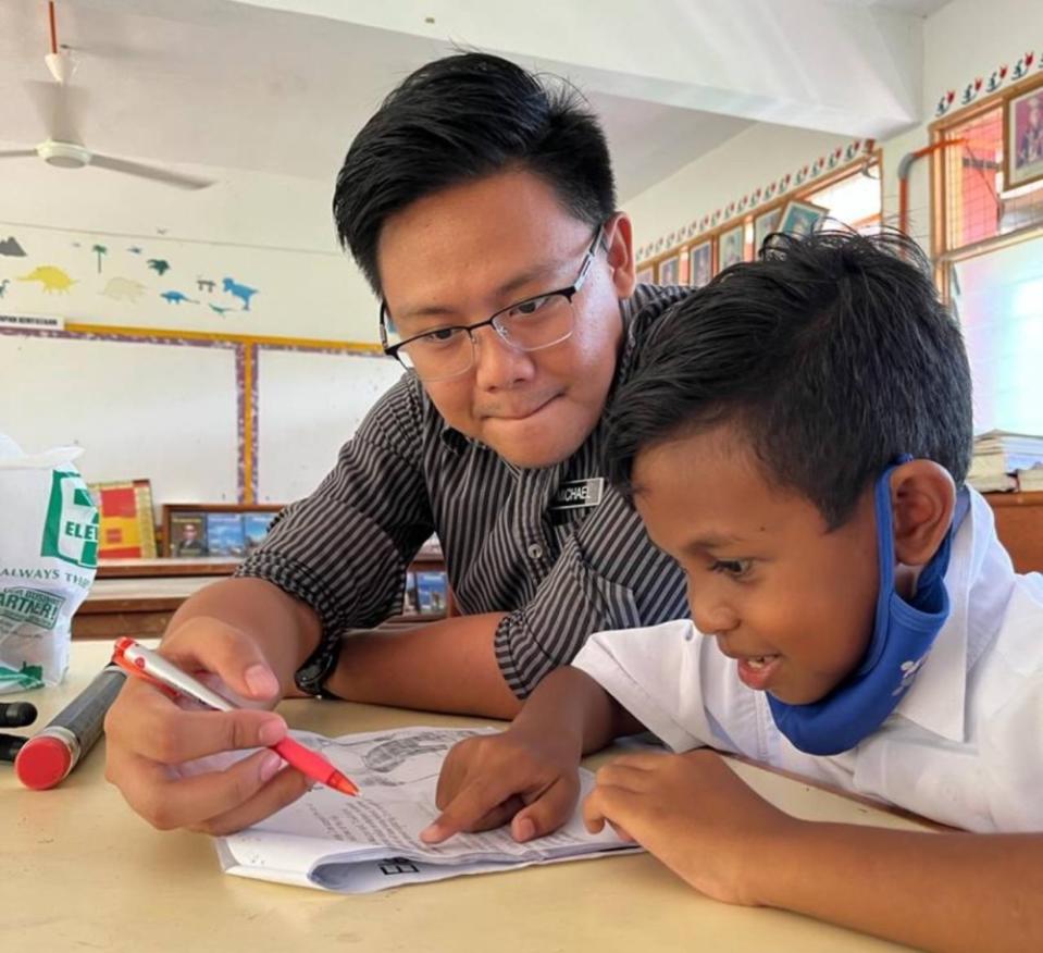 Michael training Arwin, the school’s first representative in 38 years to an English story-telling competition at Karnival SMOA — Picture courtesy of Michael Hillary Louis