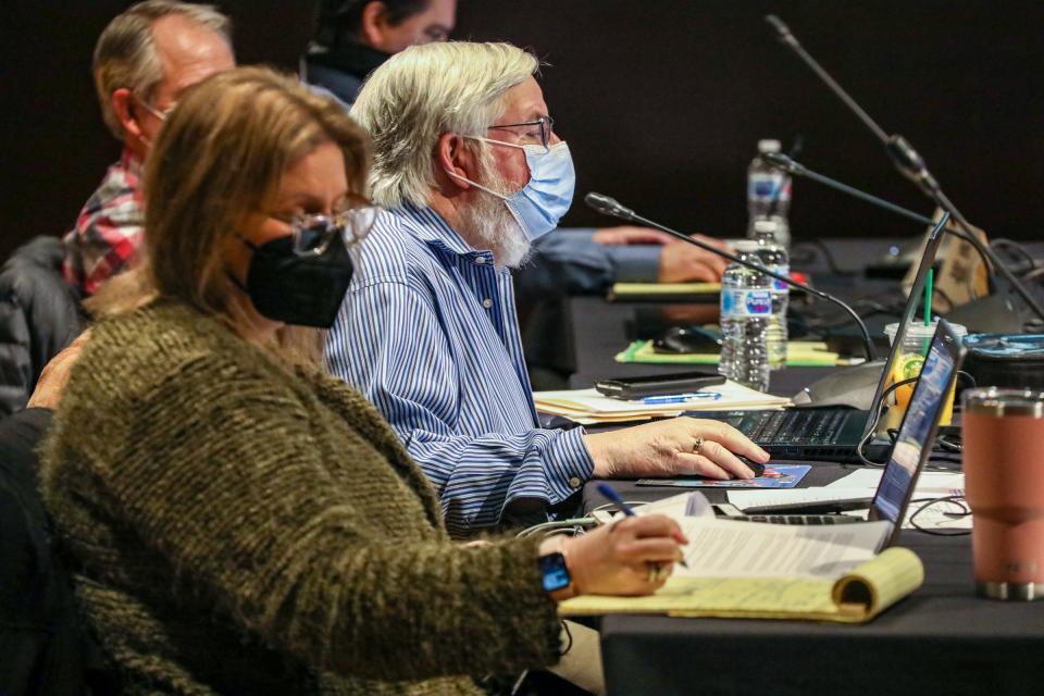 Julianne Pastula, the general counsel for the Michigan Independent Citizens Redistricting Commission, takes notes during meeting to vote on new congressional and legislative districts for the next decade in Lansing on Dec. 28, 2021.